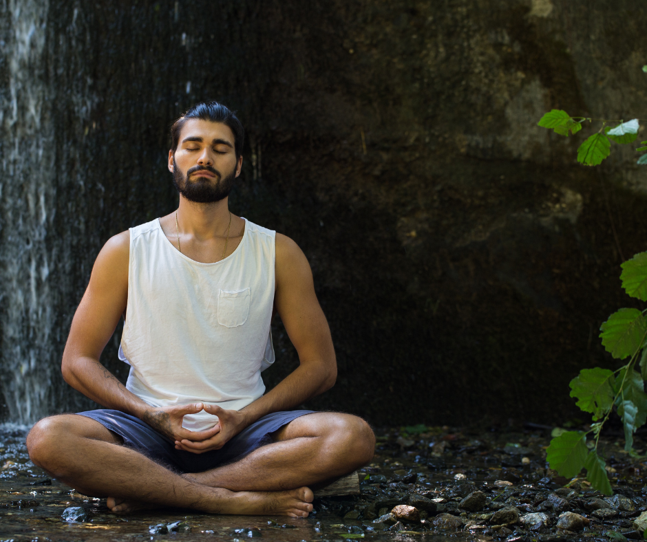 man meditating in nature